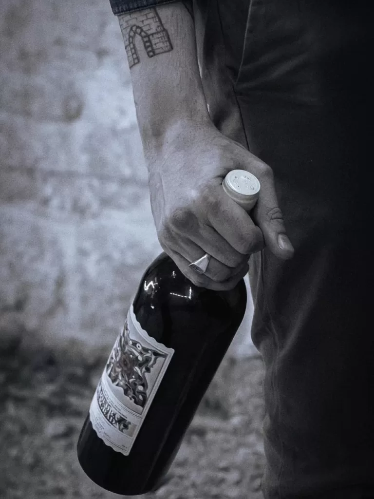 photo of wine and hand